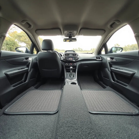 Australian-made car floor mats neatly fitted in a modern car interior, covering the front footwell area