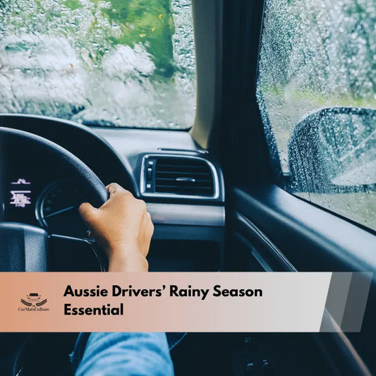 driver’s hand on the steering wheel while rain pours on the car window