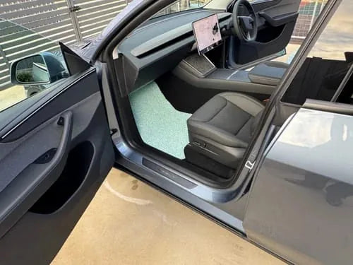 Chad S.’s Bondi Blue car mats installed in a Tesla Model Y
